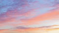 Soft, airy sky in the evening with feathery clouds in orange and blue shades