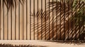 Soft and beautiful foliage dappled sunlight of tropical bamboo tree leaf shadow on brown wooden panel wall with wood grain for