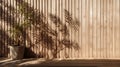 Soft and beautiful foliage dappled sunlight of tropical bamboo tree leaf shadow on brown wooden panel wall with wood grain for