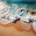 Soft beautiful ocean wave on sandy beach Background top view