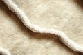 Soft beige fur texture fabric animal hair wavy seamless pattern abstract background. Fluff clothing fashion material