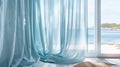 Soft billowy curtains in a light blue hue frame the windows allowing natural light to filter in and create a tranquil
