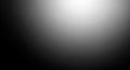 Soft Black and White Gradient Spotlight Background with Dark Vignette Effect and Subtle Light Flare Royalty Free Stock Photo