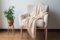 a soft blanket draped over a single chair