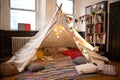 soft blanket and pillow fort, with pillows for seating, in child& x27;s room Royalty Free Stock Photo