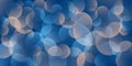 A soft blue abstract background with colorful overlapping translucent circles and gentle gradients.