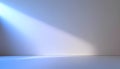 Soft blue light beam shines on smooth empty wall and floor creating calm and minimalistic interior space Royalty Free Stock Photo
