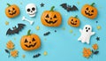 soft blue paper space, flat lay composition, with 3D catoon three pumpkins, skull, ghost and bat, net spooky elements for scary Royalty Free Stock Photo