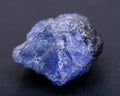 Soft blue violet rough TANZANITE from Tanzania isolated on black