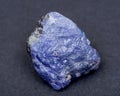 Soft blue violet rough TANZANITE from Tanzania isolated on black