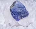 Soft blue violet rough TANZANITE from Tanzania placed on a crystalline druzy center of Polished Large Natural Blue Lace Agate