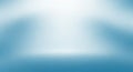 Soft Blue and White Gradient Studio Background with Subtle Spotlight Effect and Blurred Edges Royalty Free Stock Photo
