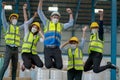Soft blur of group of factory workers man and woman jump with happy action in warehouse workplace area