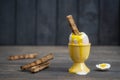 Soft boiled brown egg and toast bread in eggcup on wooden table background. Close up Royalty Free Stock Photo