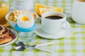 Soft boiled chicken egg, coffee, baking, muesli and orange juice Royalty Free Stock Photo