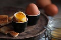 Soft boiled chicken eggs with toasted bread on wooden table, closeup Royalty Free Stock Photo