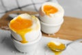 Soft boiled chicken eggs on table, closeup Royalty Free Stock Photo