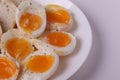 Soft boiled egg halves on the white plate and bread slices Royalty Free Stock Photo