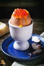 Soft-boiled egg with red caviar Royalty Free Stock Photo