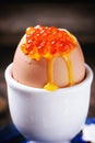 Soft-boiled egg with red caviar Royalty Free Stock Photo
