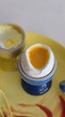 A soft-boiled egg with a runny yolk served in a blue egg cup. Royalty Free Stock Photo