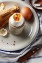 Soft boiled eggs with Buttered toast Soldiers are a classic English breakfast. Served with butter and cup of coffee