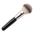 Soft bristle makeup brush with black handle and rose gold accent Royalty Free Stock Photo