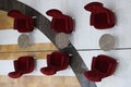 Soft burgundy armchairs and tables standing in hotel lobby top view