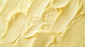 A soft butter yellow textured background with a light, airy surface