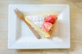 Soft cake with stawberry and ice coffe on table