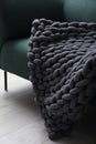 Soft chunky knit blanket on sofa indoors, closeup Royalty Free Stock Photo