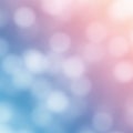 Soft circular bokeh pattern with a gradient background blending from pink to blue. The Royalty Free Stock Photo