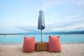 Soft colorful lounge chairs on the empty beach of Trawangan island, Indonesia