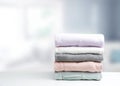 Soft colors stack of clothing,clothes folded on table empty copy space background.Garment stacked Royalty Free Stock Photo