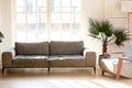 Soft comfortable grey couch and armchair in living room Royalty Free Stock Photo