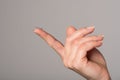 Soft contact lens on the finger of the female hand on a gray background Royalty Free Stock Photo