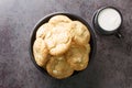 Soft cookies with macadamia nuts and white chocolate served with milk close-up. horizontal top view Royalty Free Stock Photo