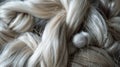 Soft cotton fibers entwined with silky hair strands symbolizing gentleness and care in a tactile closeup Royalty Free Stock Photo