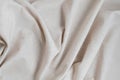 Soft crumpled neutral oat beige linen fabric texture background with folds, aesthetic minimal luxury boho wedding or