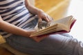 Woman and a cat reading a book Royalty Free Stock Photo