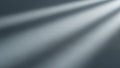 Soft diffused light rays casting diagonal shadows on a textured gray surface Royalty Free Stock Photo