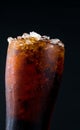 Soft drink with ice in glass isolated on dark background with co Royalty Free Stock Photo