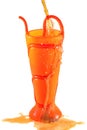 Soft drink or juice spilling out of a plastic vase