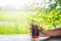 Soft drinks with ice. closeup woman Hand holding glass of cola d Royalty Free Stock Photo