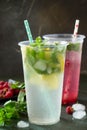 SOFT DRINKS. Refreshing summer drink lemon with mint, ice and raspberry with basil, ice. Royalty Free Stock Photo