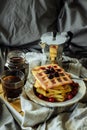 Soft Dutch waffles for breakfast with coffee near the window. Royalty Free Stock Photo