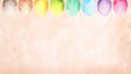 Soft Easter background with a pastel watercolor border of colorful eggs along the top. Royalty Free Stock Photo