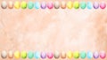 Soft Easter background with a pastel watercolor border of colorful eggs along the top. Royalty Free Stock Photo