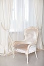 Soft elegant armchair near the window