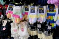 Soft and fabric gloves hang on shelves for sale in Daiso grocery at Blueport Shopping mall. Hua Hin, Thailand November 1, 2018 Royalty Free Stock Photo